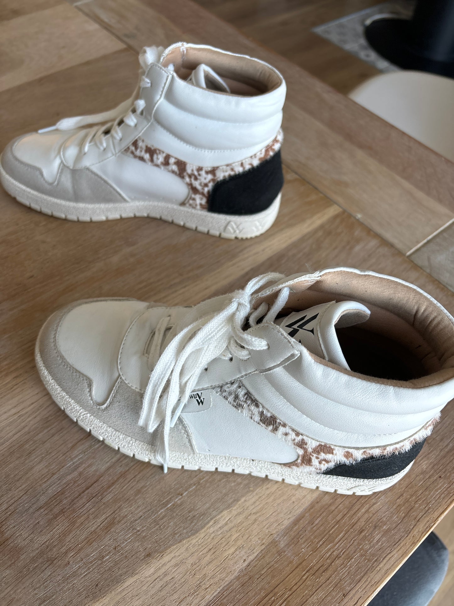 White Kassidy high-top sneakers with cow detail